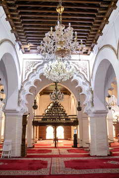 Grand Interior Nave of the Great Mosque of Tlemcen with Red Carpet and Crystal Chandeliers