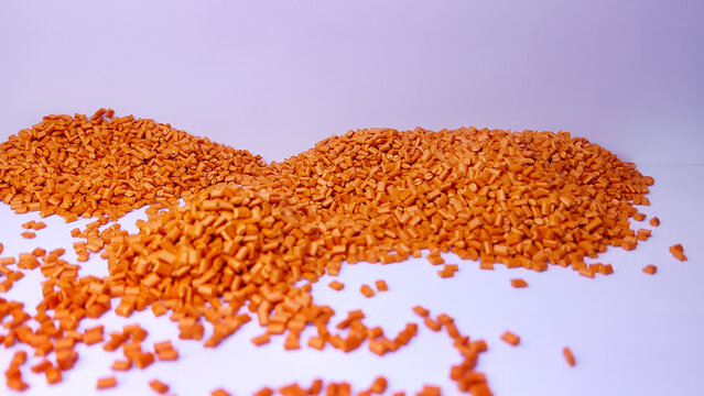 Blue masterbatch granules , cold cutting type, polymer carries color pigment poured into a white background medium, suitable for product catalog design of industrial plastic company profiles