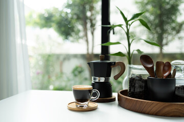 Coffee and moka pot set arranged on white table, morning relaxing routine © paladin1212