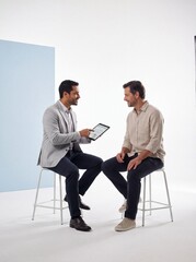 Obraz premium Doctor Explaining Personalized Health Plan to Patient on Tablet