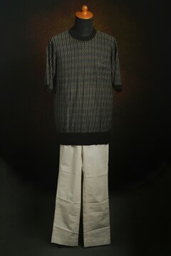Men's fashion knitwear with white trouser displayed on a mannequin