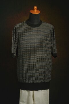 Men's fashion knitwear with white trouser displayed on a mannequin