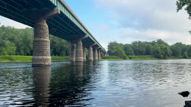 Stone Bridge Piers Reflecting on the Delaware River in Summer