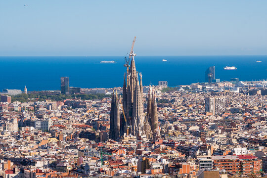 Elevated View of Barcelona City With Famous Sagrada Familia Church and Mediterranean Sea in the Horizon