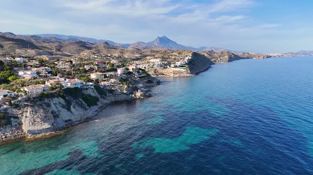 Rocky Headland with Turquoise Water and Mountain Peak near El Campello, Costa Blanca, Alicante, Spain