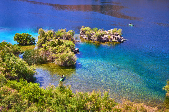 Kayakers on Crystal Clear Colorado River by Lush Green Islands Willow Beach Arizona