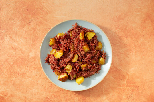 A top down view of a plate of corned beef hash.