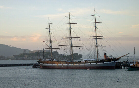 Historic sailing ship Balclutha moored in San Francisco Bay at dusk