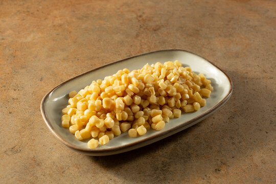 A view of a plate of canned white corn.