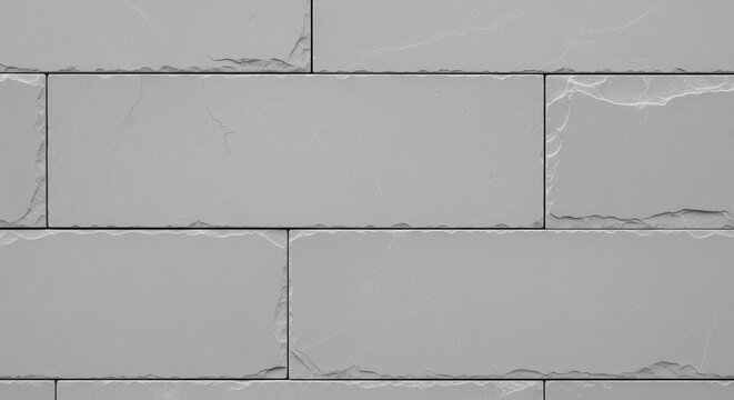 Seamless grey stone wall texture with rectangular tiles.