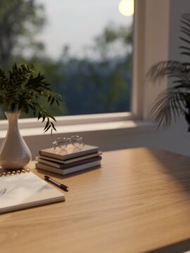 Cozy workspace desk with notebook pen glasses and plant vase near window