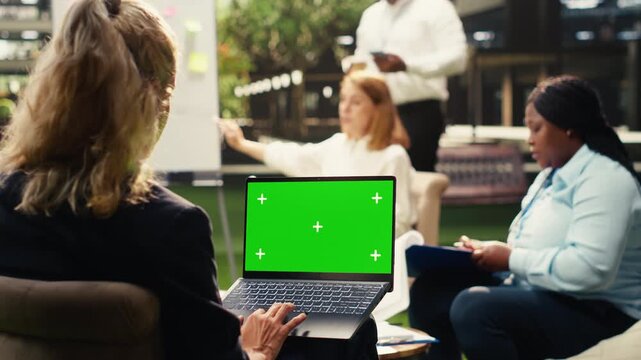 Isolated mockup screen replacement on laptop device with blank screen, businesswoman emphasizing productivity and holding computer with editable screen, outdoor workspace, for screen replacement.