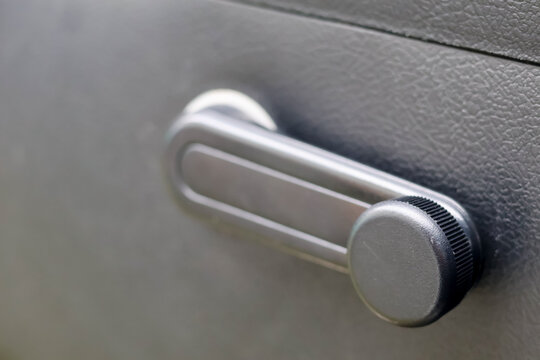 Car Window Crank Handle Inside Vehicle.