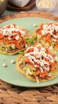 Chicken tinga tostadas with fresh ingredients. Mexican food