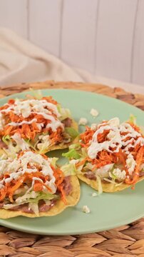 Close-up of Mexican tostadas de tinga served on a plate