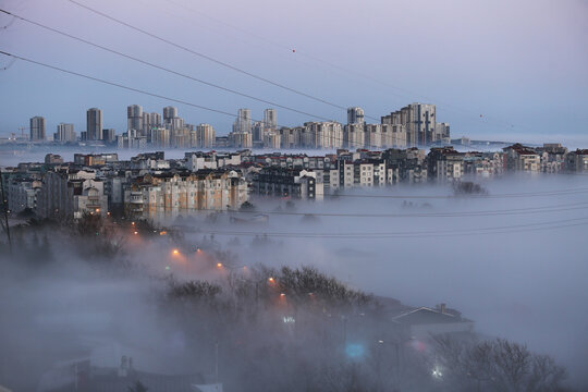 City buildings at foggy sunrise in Istanbul, Turkey.