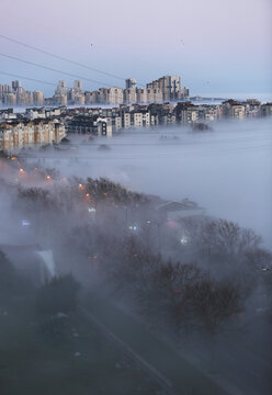 City buildings at foggy sunrise in Istanbul, Turkey.