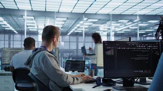 Data center manager admonishing programmer after making error in data center from a secondary camera angle while connecting protected data, access control and server room reliability.