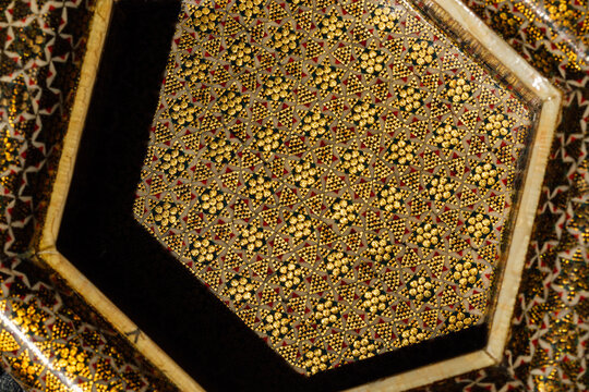 geometric pattern hexagonal box in islamic design with gold