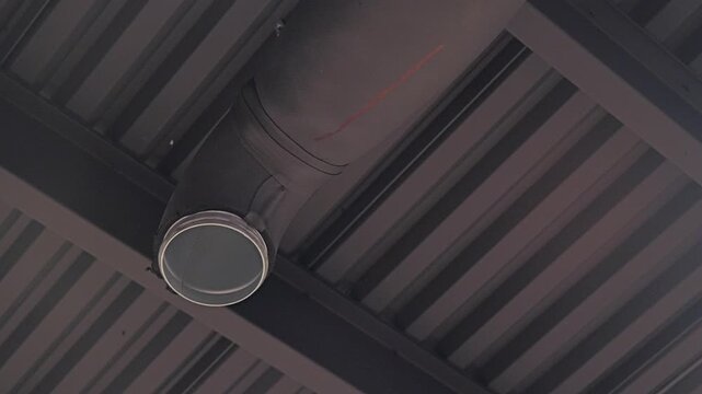 Installed HVAC air duct with foam insulation inside modern commercial facility