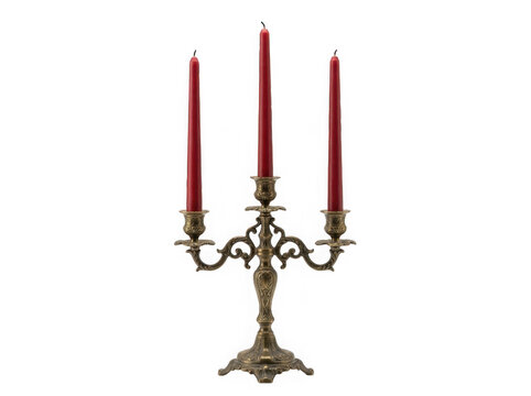 An ornate antique brass candelabra with three tall red candles isolated on transparent background