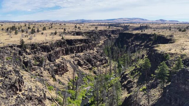 Over millennia Mill Creek has carved a 230-foot deep canyon on the Central Oregon plateau between Bend and Portland. This rugged yet scenic area of high desert is part of the Warm Springs reservation.