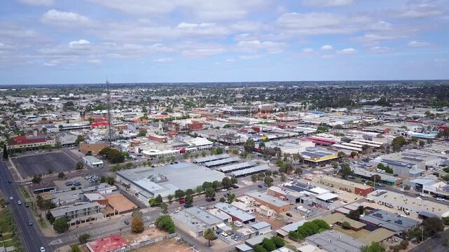 Aerial view of Mildura Central Business District in Victoria, Australia, showcasing Deakin Avenue's iconic palm trees, shopfronts, and grid-pattern streets - DLOG Flat File 4K
