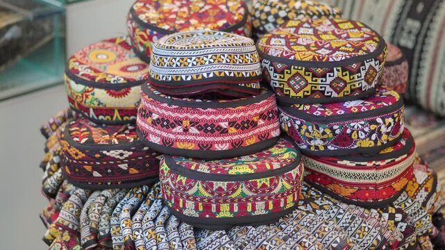 Colorful hats displayed on a table in a shop