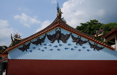 Traditional Chinese temple gable decorated with bat motifs symbolizing blessings and good fortune © BH