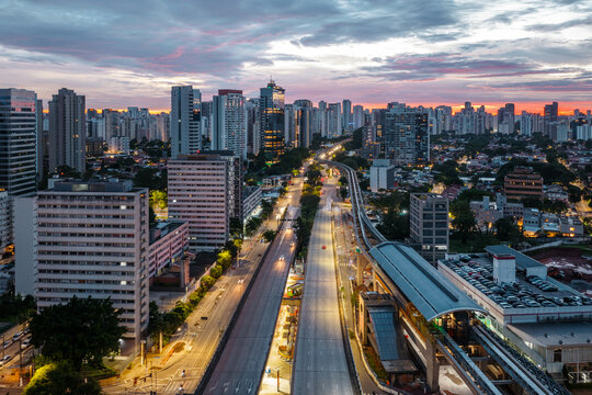 Illuminated city avenue and buildings at dusk, Sao Paulo, Brazil