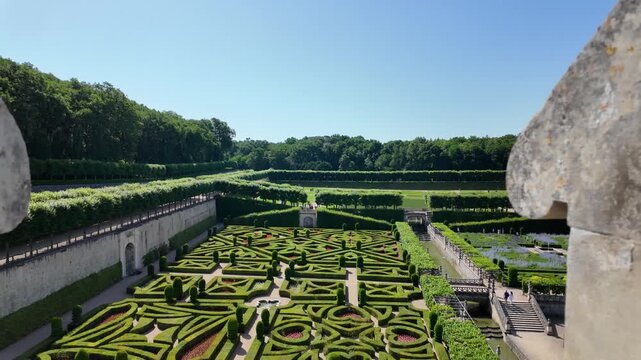 Slow motion video overlooking the iconic ornamental gardens of Chateau de Villandry from the castle terrace, showcasing the famous geometric parterres and Renaissance landscape design