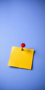 A small, yellow sticky note with a red push pin, office, organizer