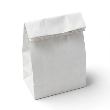 A clean, empty white paper lunch bag stands upright with its top folded down on a bright, isolated white background under soft studio lighting.