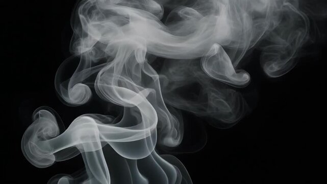 Swirling white smoke patterns on a black background