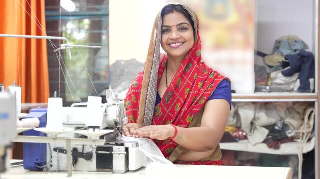 Young Indian woman operating sewing machine in a textile workshop, creating garments, craftsmanship, traditional industry, and female entrepreneurship. Skill india. 