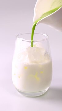 Iced matcha latte on a white background.