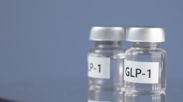 Hopeful medical liquid medicine glp 1 vial for obesity hormone treatment, clear glass bottle diabetes therapy on blue background