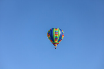 Naklejka premium A colorful hot air balloon flying on the sky in Temecula California USA.