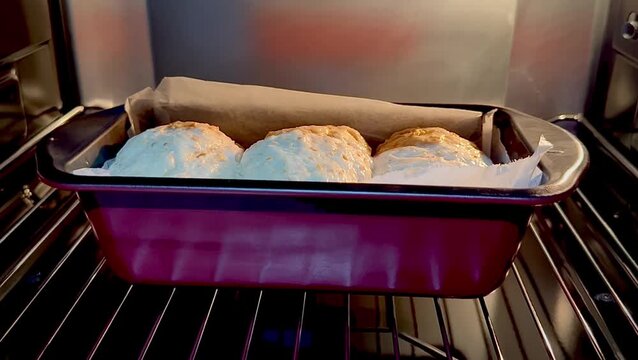 Final proof dough lined with  parchment paper is in Oven