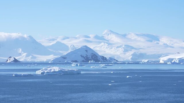 Cinematic Antarctica Sailing in Wilhelmina Bay. Epic Wide Panoramic White Snow Glaciers, Icebergs, Clear Bright Sunny Day From Cruise Ship Mountain
