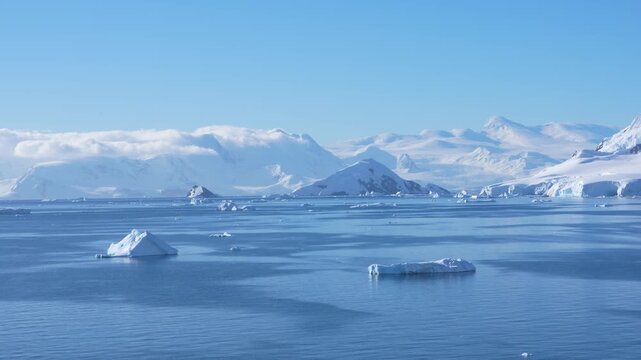 Cinematic Antarctica Sailing in Wilhelmina Bay. Clear Bright Sunny Day Epic Wide Panoramic White Snow Glaciers, Icebergs, From Cruise Ship Mountain