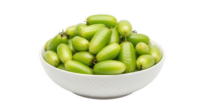 Fresh green bilimbi fruits in a white ceramic bowl isolated on transparent background