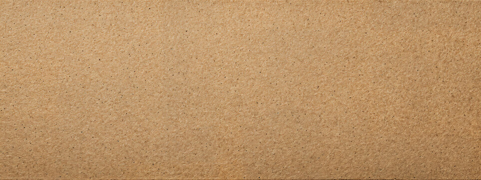 Warm tan recycled kraft paper texture with subtle fibers and clean full-frame surface