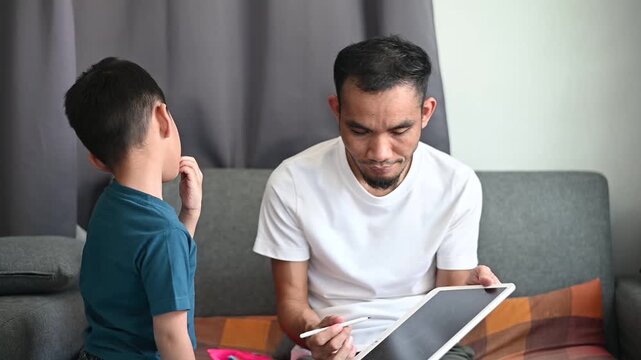 Father and son Magnetic Drawing Board creates a loving and smiling childhood moment.