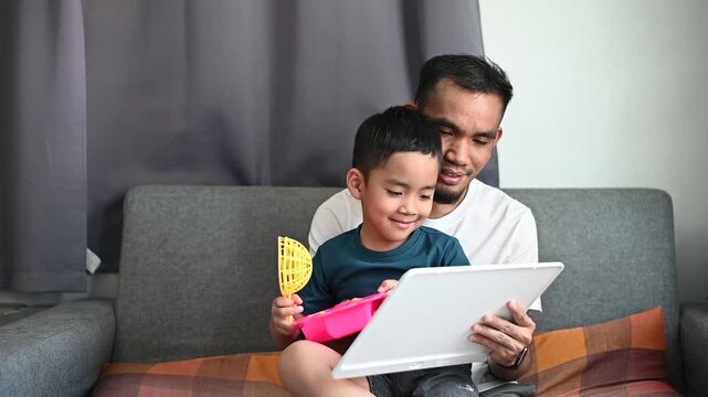 Father and son Magnetic Drawing Board enjoy creative doodle and sketch activities at home.
