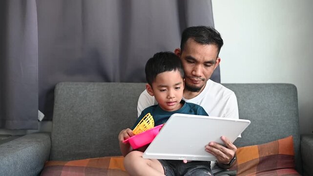 Father and son Magnetic Drawing Board helps support toddler development and learning.