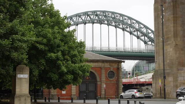 Famous steel arch Tyne Bridge spanning above urban Newcastle in North England