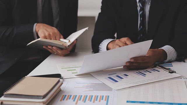 corporate, finance, budgeting, accounting, document, revenue, expenses, profit, audit, strategy, Person using calculator and reviewing financial documents for accounting and budget planning.