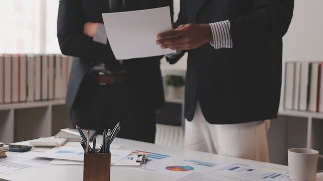 corporate, finance, budgeting, accounting, document, revenue, expenses, profit, audit, strategy, Person using calculator and reviewing financial documents for accounting and budget planning.