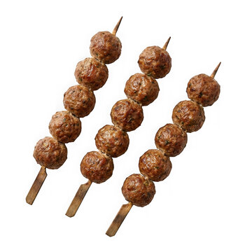 Three skewers of grilled meatball kebabs isolated on transparent background